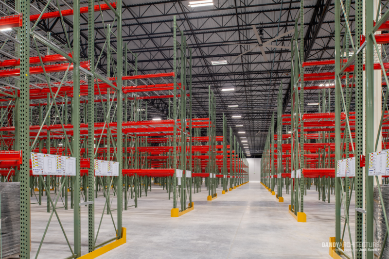 Empty stocking shelves in warehouse interior.