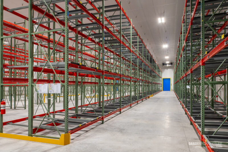 Empty stocking shelves in warehouse interior.